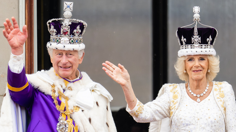 King Charles III and Queen Camilla appear on the balcony of Buckingham Palace following their coronation in London, England (2023)