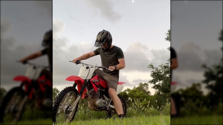 Robert Irwin on red motorbike