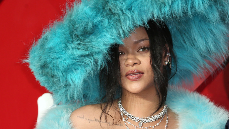 Rihanna wearing blue furry hat