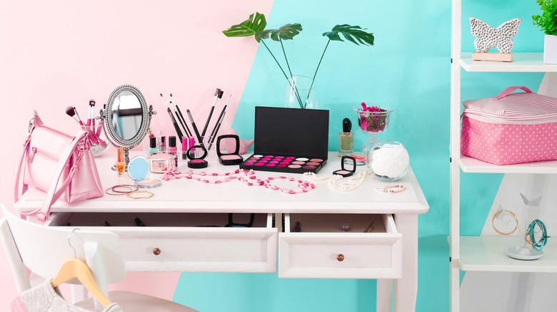 desk with makeup on it