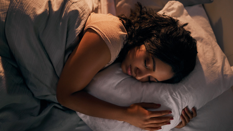 woman sleeping on pillow