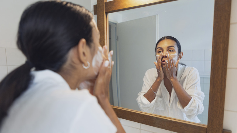 Woman washing her face