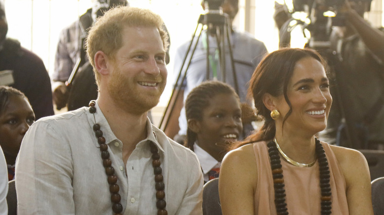 Prince Harry and Meghan Markle smiling