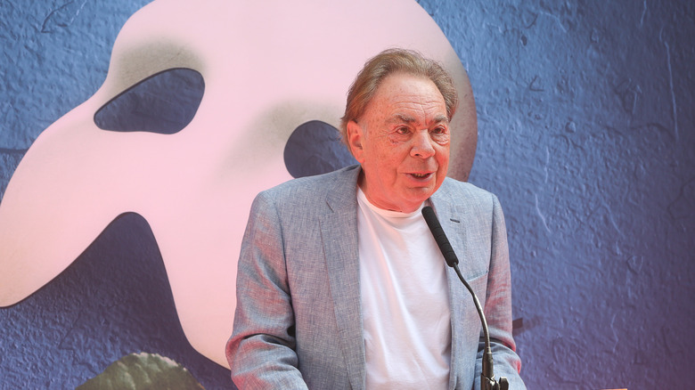 Andrew Lloyd Webber with Phantom logo