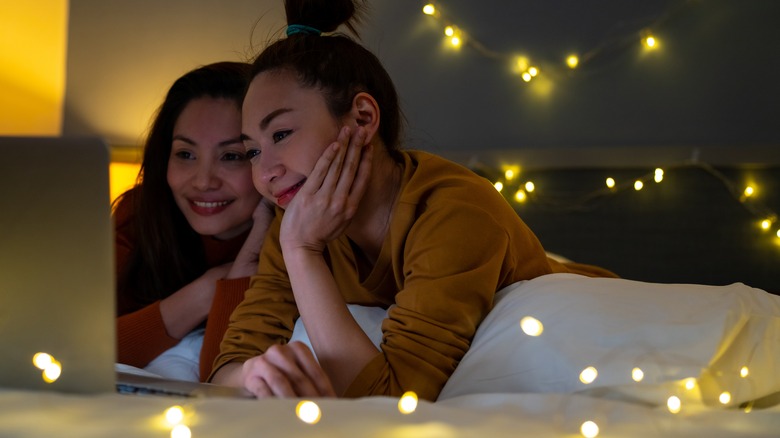 Two women looking at a laptop