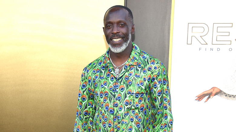 Michael K. Williams in a peacock print outfit at an event