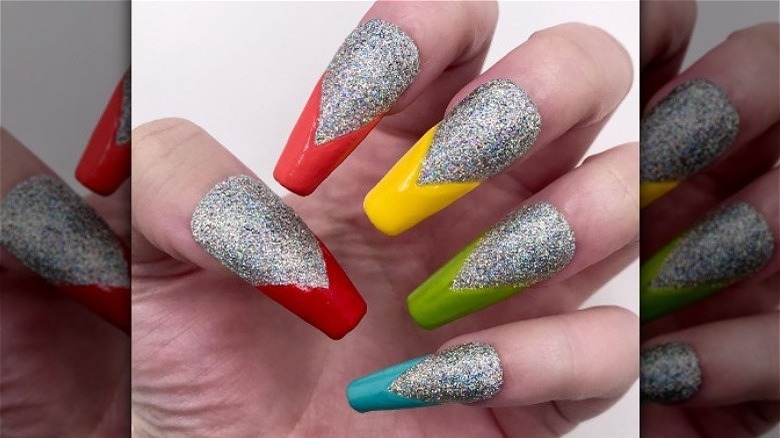 silver glitter nails with neon arrow tips