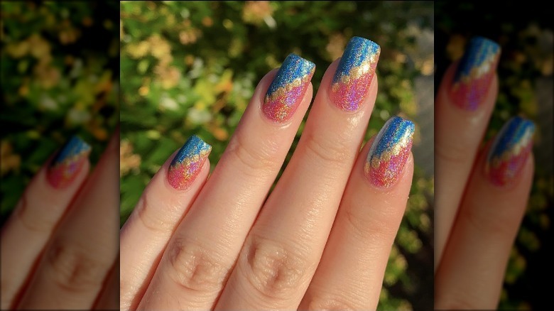 glitter nails with angled gold dots