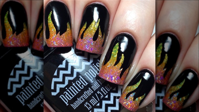 black nails with multi-color glitter flames