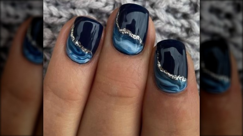 blue nails with marbling and glitter