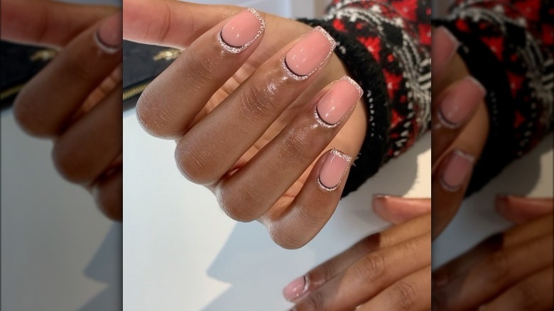 peach nails with silver glitter outlining