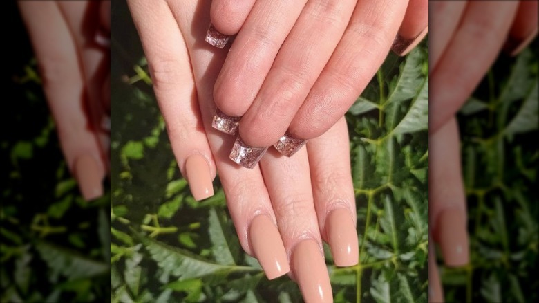 pale nails with gold glitter underneath