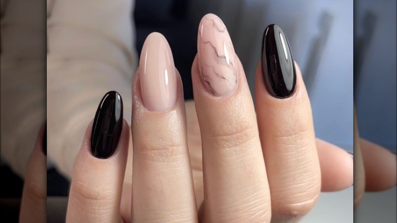 Marble nails with black accent nail