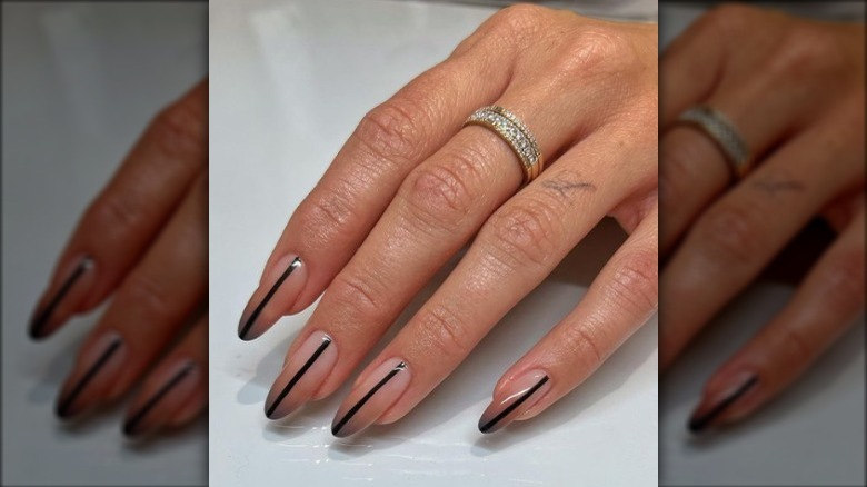 Sleek black line manicure design 