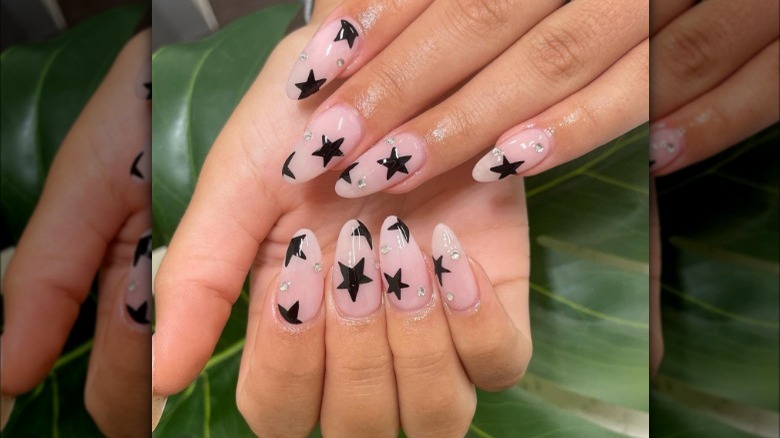 Nude nails with star design and gems 