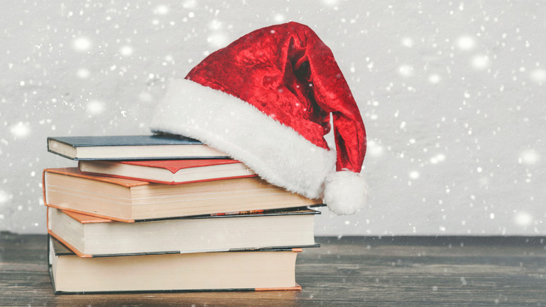 santa hat on top of books