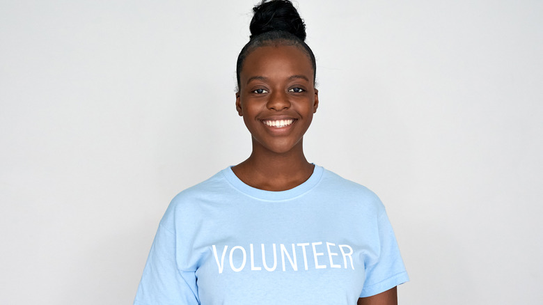 teenage girl in volunteer shirt