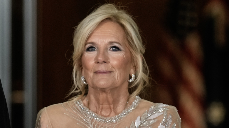 Jill Biden wearing diamond earrings with her hair pulled back