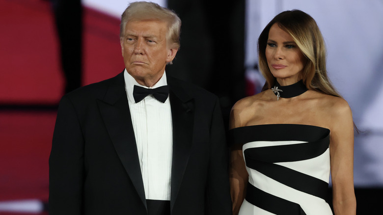 Donald Trump and Melania Trump posing for photos