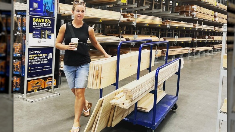 Jana Duggar wheeling lumber cart