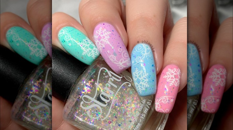 Pastel snowflake Skittles nails 