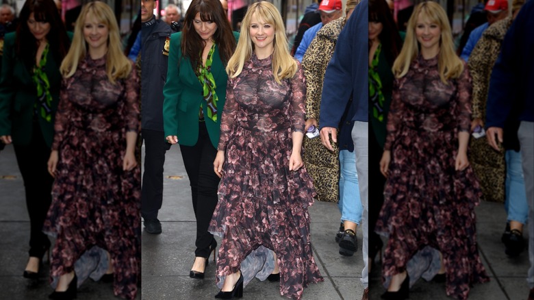 Melissa Rauch on an NYC sidewalk in a long dress with ruffles