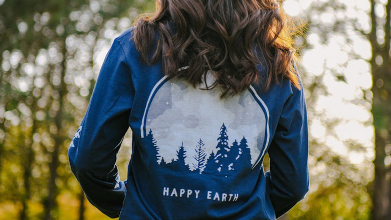 woman wearing happy earth long sleeved shirt