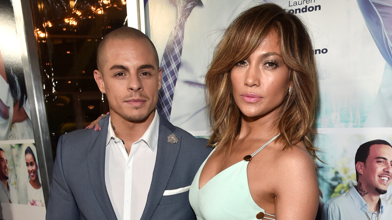 Jennifer Lopez posing on the red carpet with Casper Smart