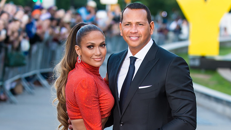 Jennifer Lopez smiling alongside Alex Rodriguez