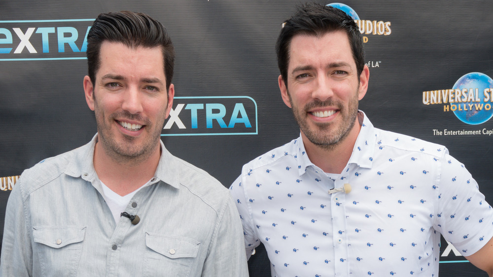 Jonathan and Drew Scott wearing white shirts