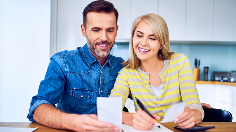 happy couple going over finances