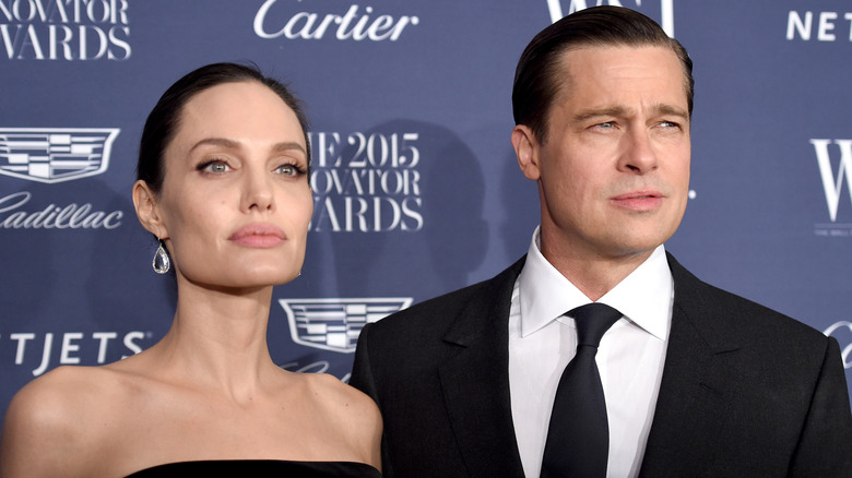 Angelina Jolie and Brad Pitt posing for photos