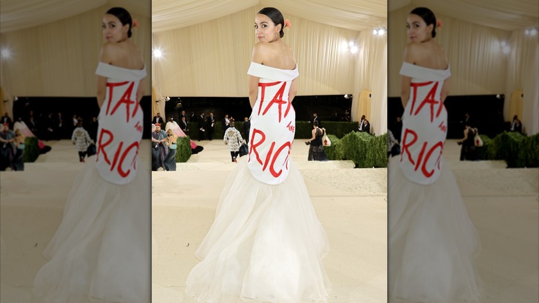 Alexandria Ocasio-Cortez on the 2021 Met Gala red carpet wearing a dress that says Tax the Rich