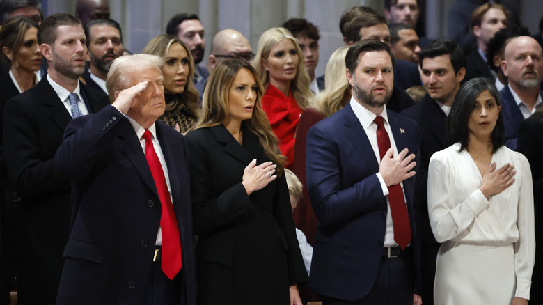 Donald Trump salutes while Melania Trump, JD Vance, and Usha Vance pledge allegiance