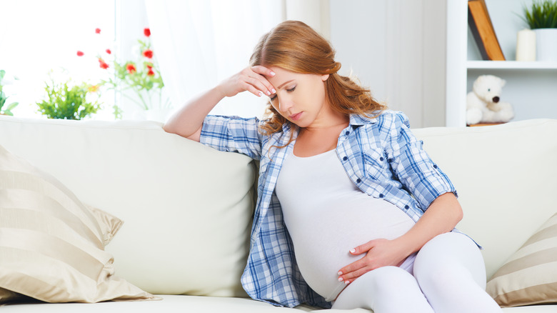 pregnant woman sitting down