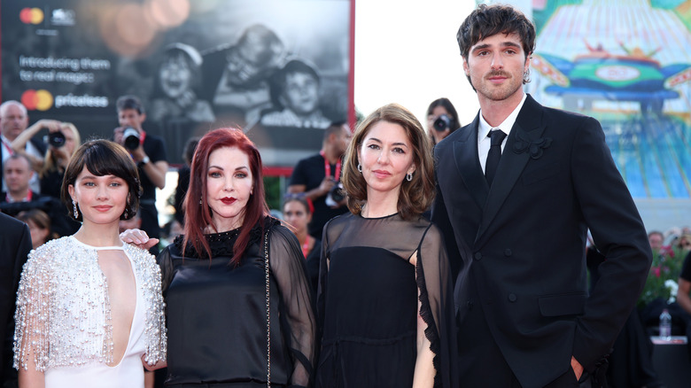 The cast and director of 'Priscilla' with Priscilla Presley at the film's red carpet in 2023