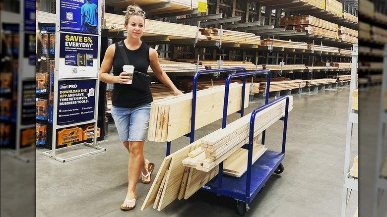 Jana Duggar with lumber on hand truck and coffee