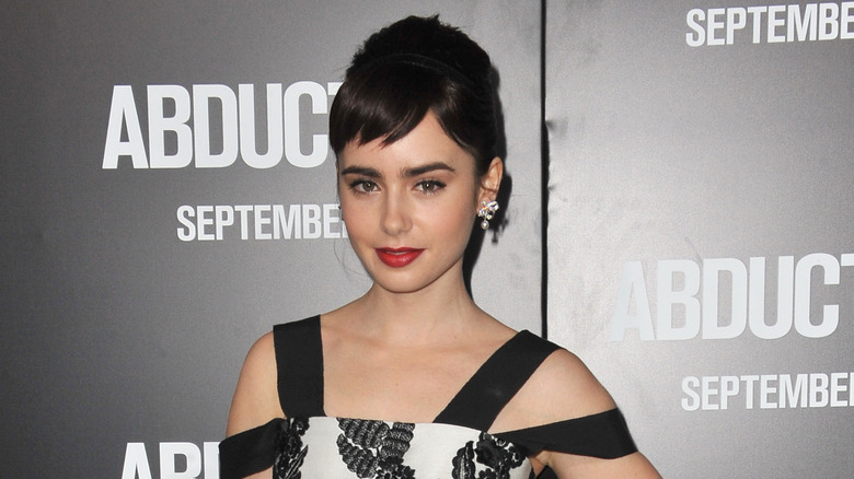 lily collins posing with pixie bangs