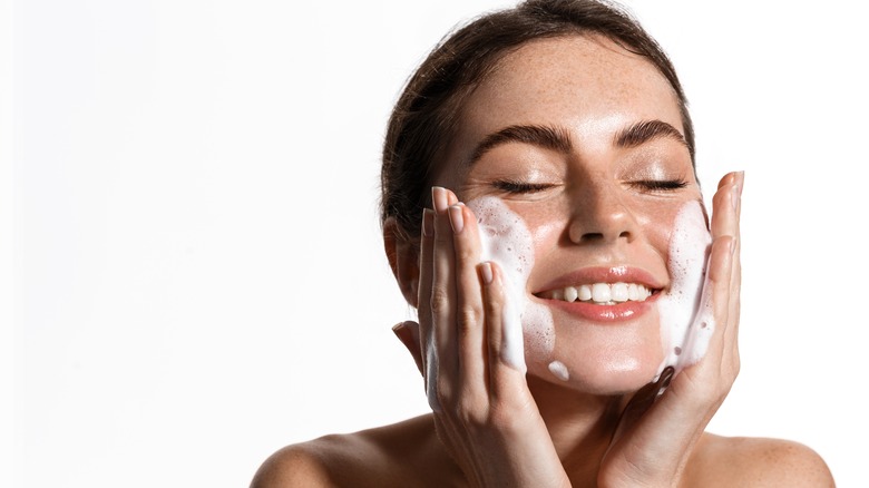 Woman washing her face