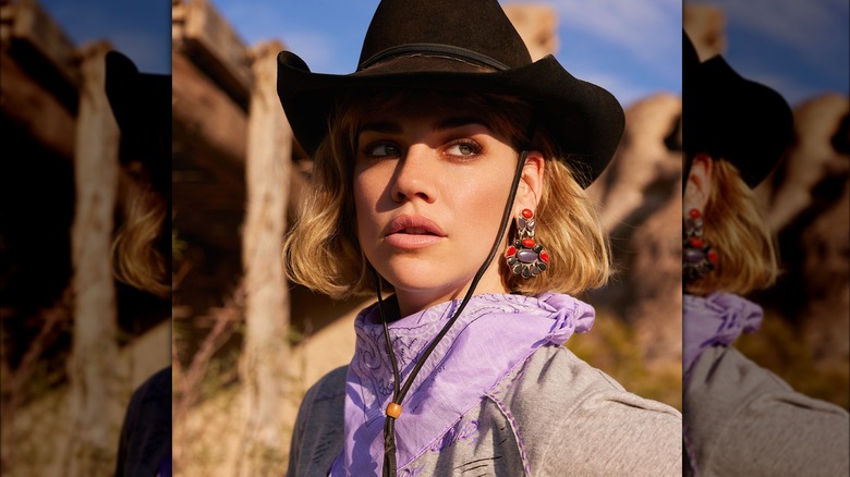 Blond woman in western hat and purple bandana