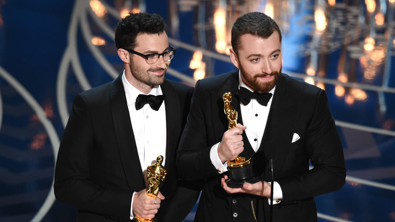 Sam Smith holding an Oscar