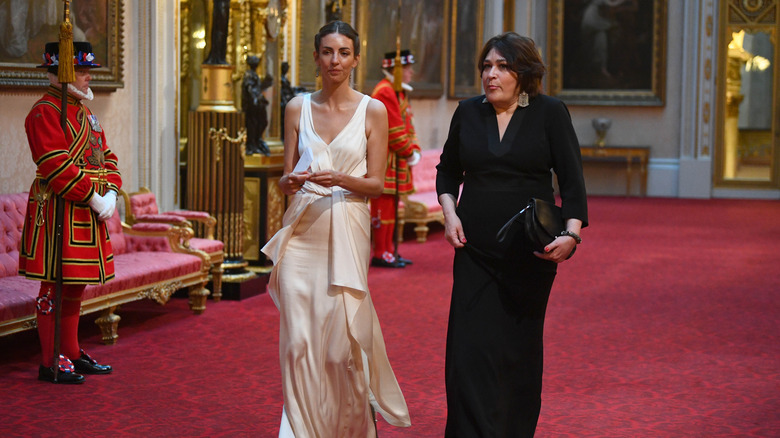 Rose Hanbury walking through Buckingham Palace halls