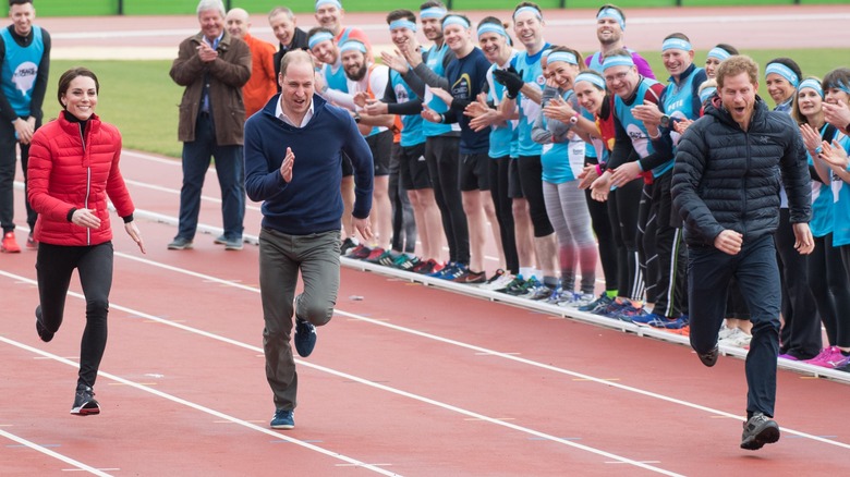 Princess Kate, Prince William, and Prince Harry engaged in a footrace