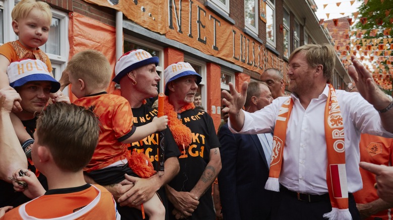 King Willem-Alexander (right) with Dutch football fans