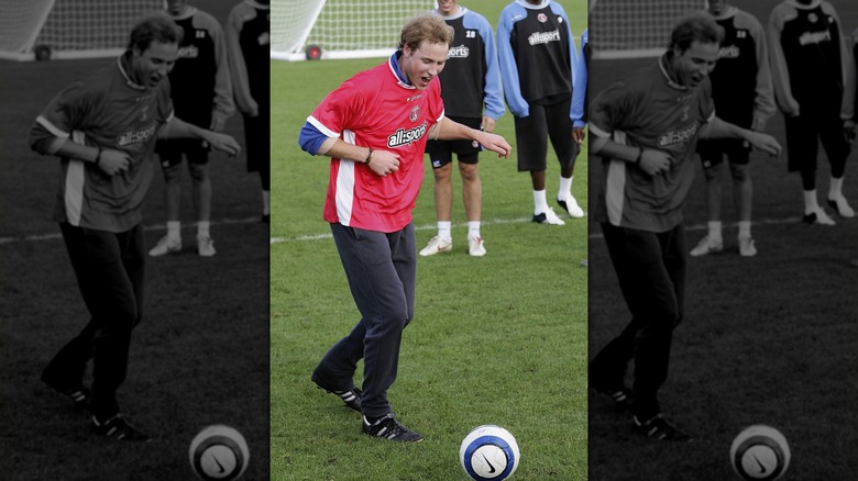 Prince William kicking a soccer ball in a Charlton Athletic jersey