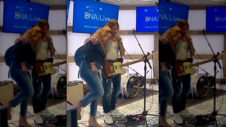 Keith Urban hugging a fan at the airport