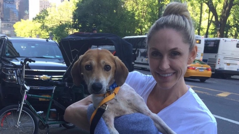 Lara Trump holding up her dog