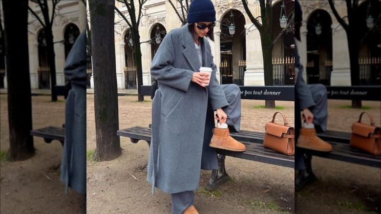 Woman wearing oversized trench coat 