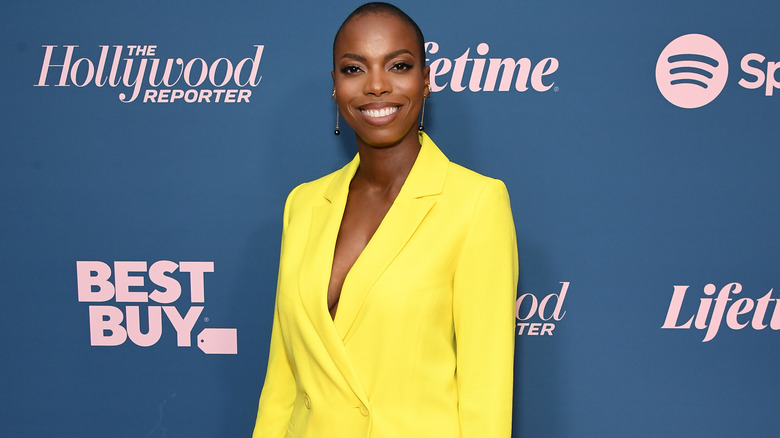 Sasheer Zamata in a bold yellow suit