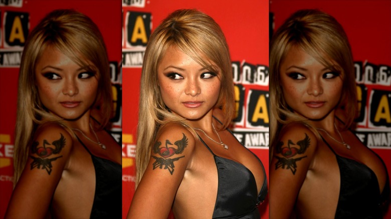 A blonde Tila Tequila looking over her shoulder